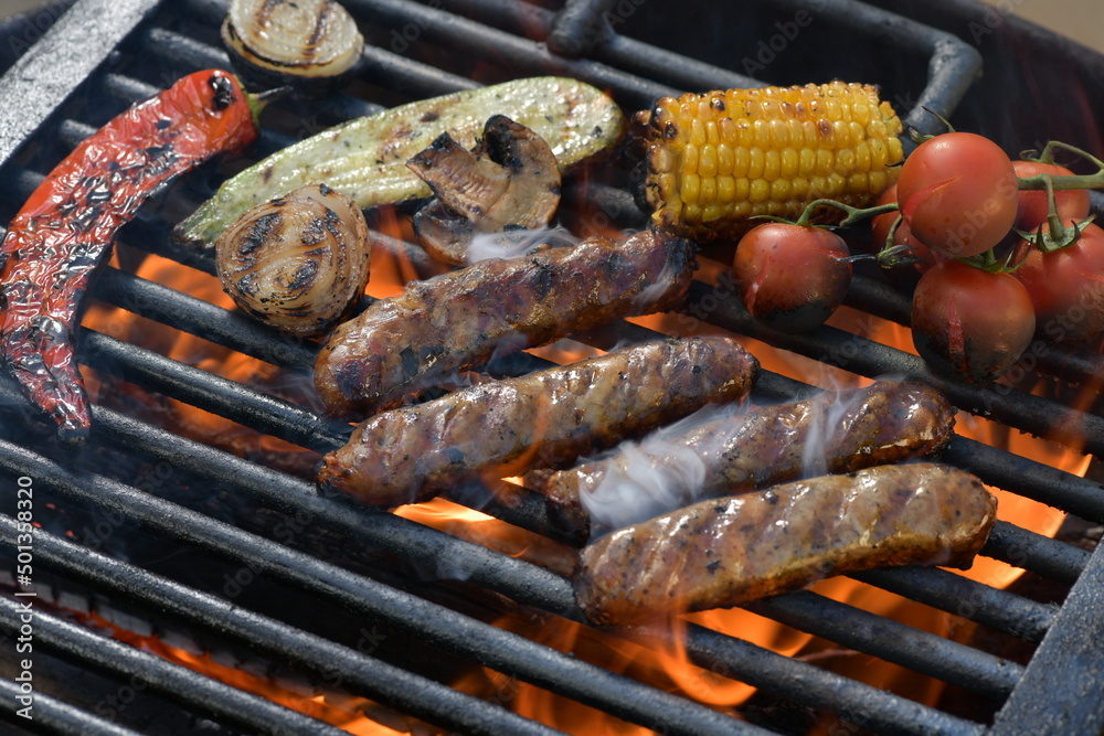 juicy meat sausages fried over an open fire
