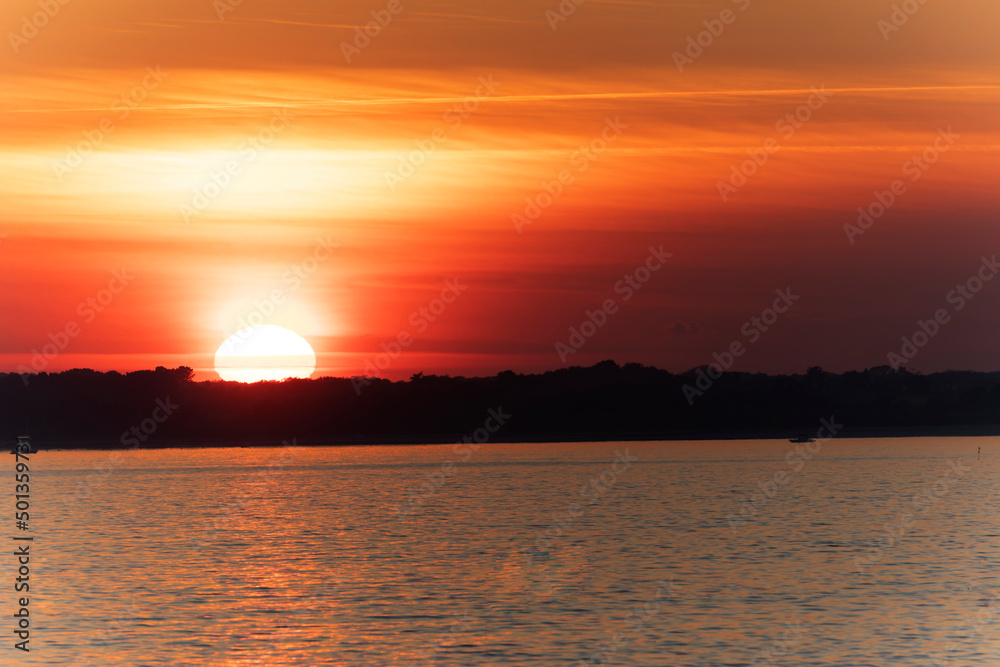 Sunset or moon-rise on the seaside in Morbihan, Bretagne, France