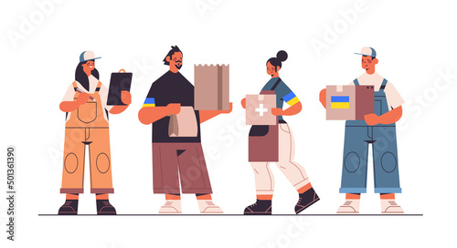 volunteers giving help boxes with Ukraininan flag to refugees humanitarian aid material assistance governmental help