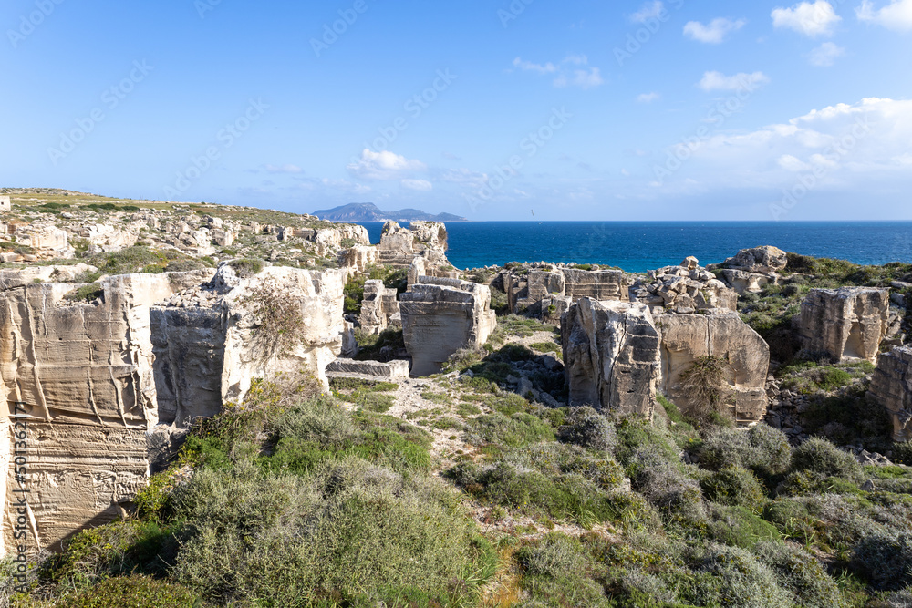 Calcarenite quarries at Cala Rossa beach. Characteristic limestone landscape of the sea coast of Favignana, (Egadi) Aegadian Islands, Trapani, Sicily, Italy