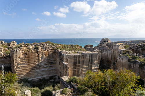 Calcarenite quarries at Cala Rossa beach. Characteristic limestone landscape of the sea coast of Favignana, (Egadi) Aegadian Islands, Trapani, Sicily, Italy