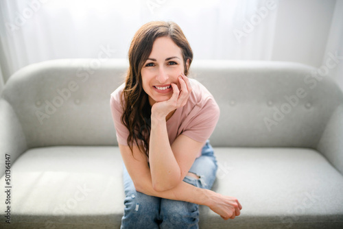 girl relaxing at home on couch, enjoying free time