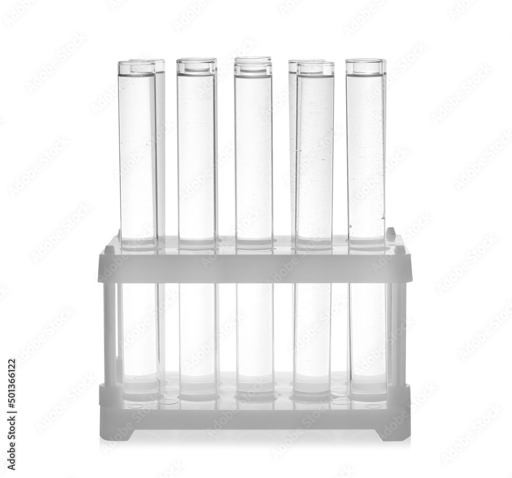 Test tubes with transparent liquid in holder isolated on white Test tubes with transparent liquid in holder isolated on white