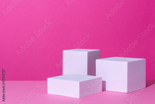 Empty podium or stand for product showcase on pink background photo