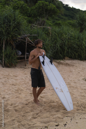 Photography Sexy surfer surfing man with surfboard