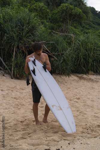 Photography Sexy surfer surfing man with surfboard