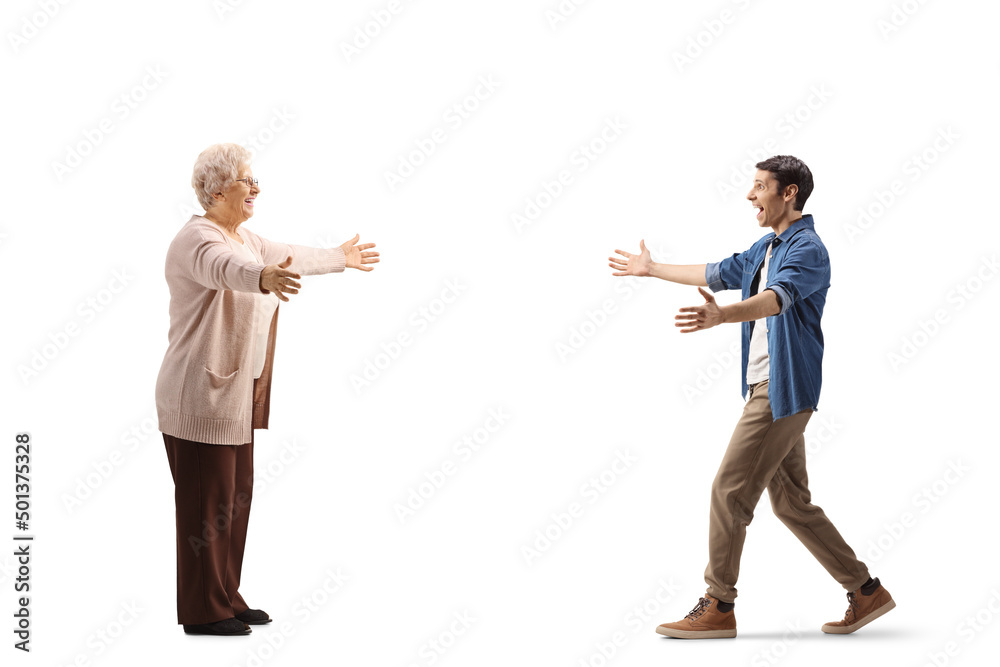 Full length profile shot of a young man walking towards an elderly woman with arms wide open Full length profile shot of a young man walking towards an elderly woman with arms wide open