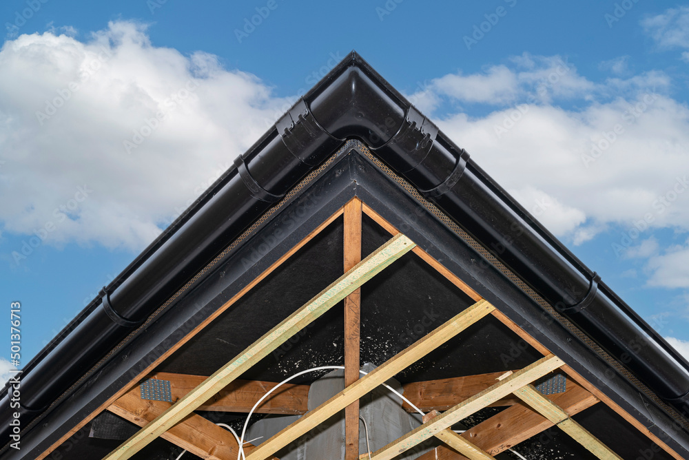 Scaffolding with three rows of wooden battens for attaching the PVC soffit, visible cables for lighting. Scaffolding with three rows of wooden battens for attaching the PVC soffit, visible cables for lighting.