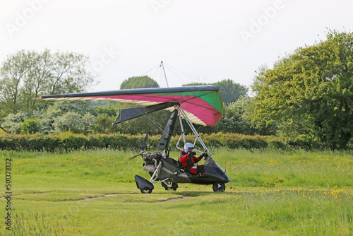 	
Ultralight airplane taking off from a farm strip	
