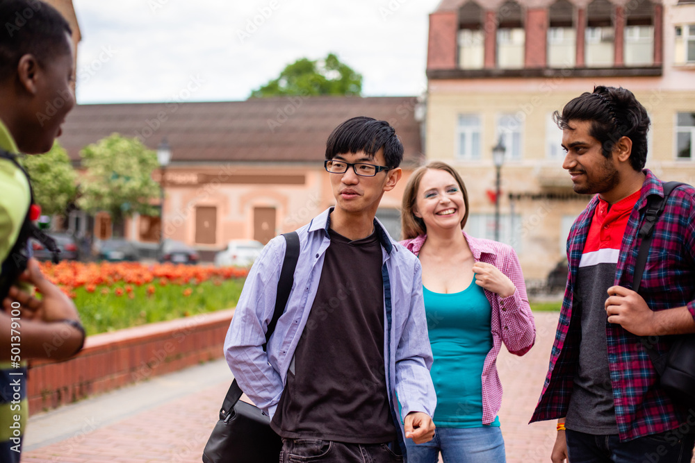 Obraz premium Cheerful girl feeling happy among her diverse friends
