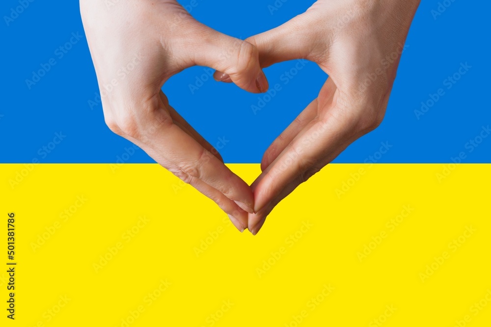 Obraz premium The concept love of the Ukraine. Heart in female hands.