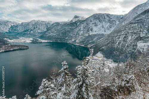 View from the mountain to winter Hallstatt, a village near a lake in the Alpine mountains