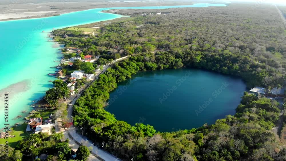 Aerial Drone Shot of Beautiful Cenote Azul and view on 7 seven colors lagoon in Bacalar, Quintana Roo, Mexico