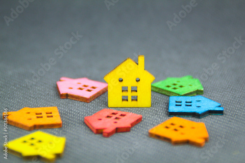 a model of a colored wooden house with the concept of a housing crisis photo