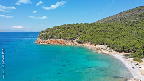 Aerial drone photo of paradise bay and turquoise beach of Dragonera covered in pine trees in small island of Agistri  Greece