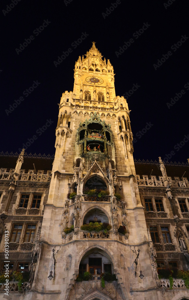 night view of the clock tower of the New Town Hall in Munich in Berlin in Germany called neues RATHAUS