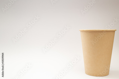 Disposable paper cup on white background, social theme