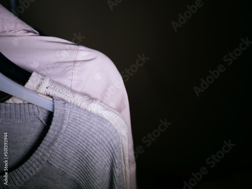 Clothes hung on a clothes rail close up shot 