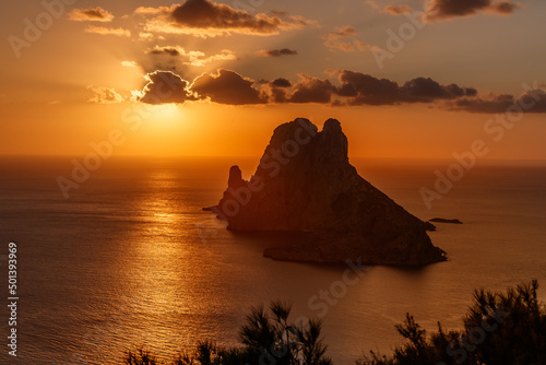 Aerial shot of a beautiful sea in Ibiza, Spain during the sunset