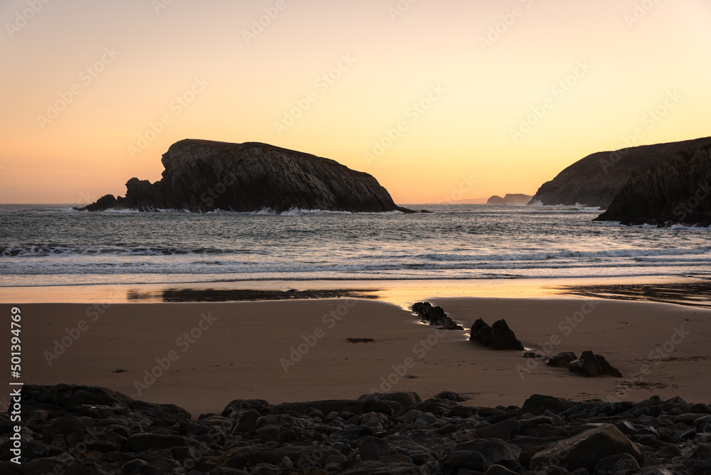 The spectacular rock formations on the shore of La Arnía beach at sunrise, Costa Quebrada, Liencres, Cantabria, Spain