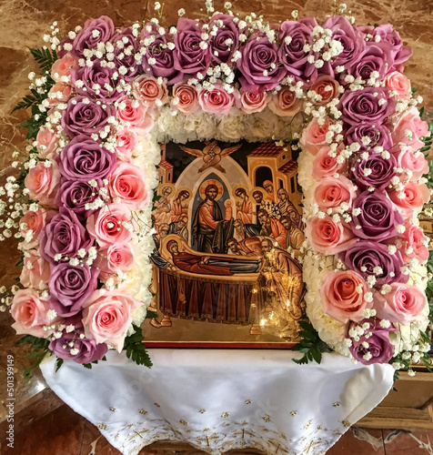 Dormition of the Mother of God icon with flowers photo