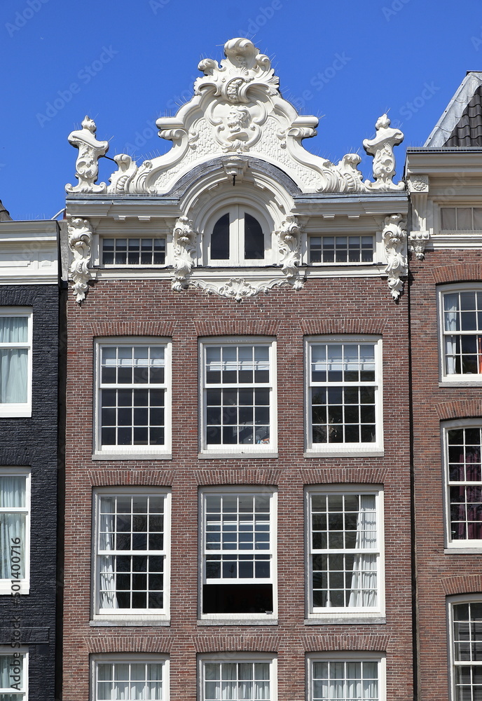 Amsterdam Prinsengracht Canal House Facade with Sculpted Roof Detail, Netherlands