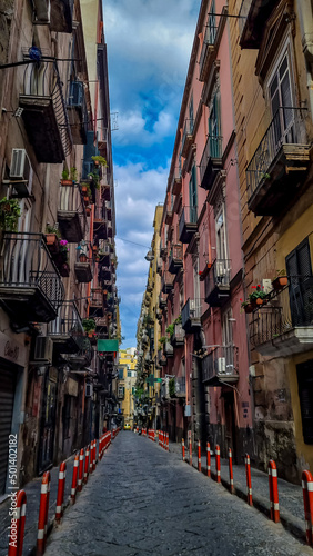 Walking in the narrow streets of Naples, Campania, Italy, Europe. Narrow alleyway in the old town of Naples. Area belongs to a UNESCO World Heritage site as part of the historic city center of Naples © Chris
