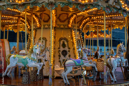 Carousel for kids with lights on in Barcelona © Ana