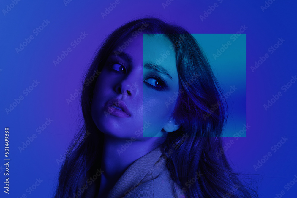A girl in a jacket looks away on a blue neon background, futurism style, back in the 90s, poster, multi-colored,