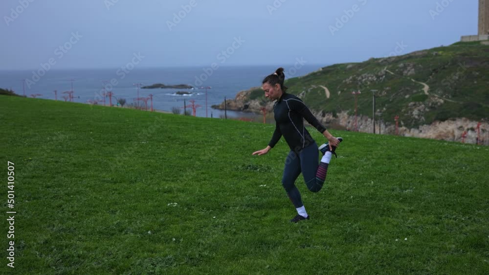 An athletic girl does physical exercises in the fresh air. An athletic girl does physical exercises in the fresh air.
