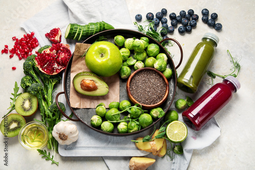 Assorted detox smoothie juices on light background.