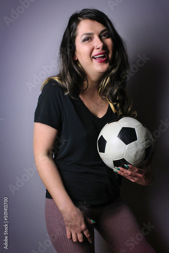 woman holding soccer ball making facial expressions © SaraSRosado