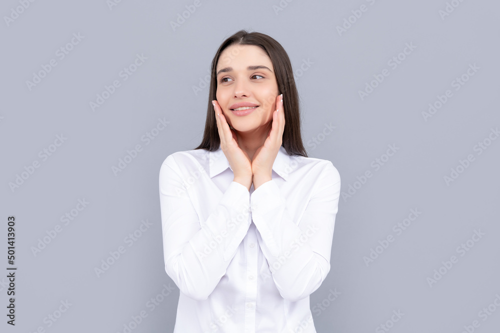 positive businesslike woman in white shirt on grey background, portrait positive businesslike woman in white shirt on grey background, portrait