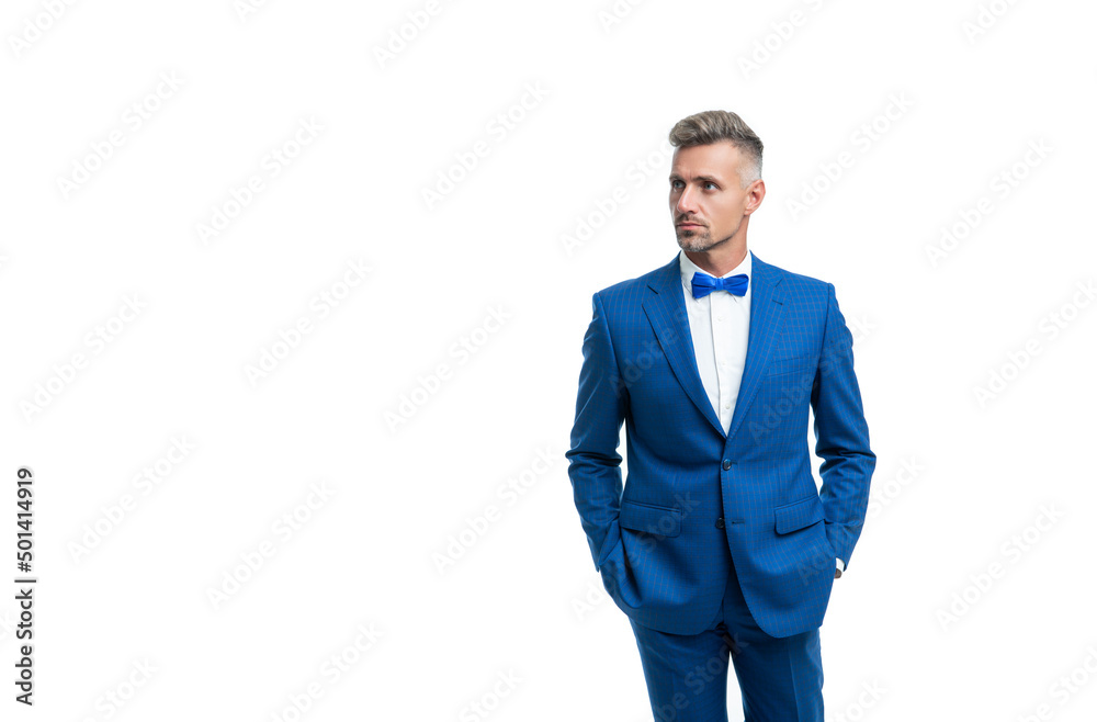 adult businessman in blue tuxedo suit with neck bow isolated on white background adult businessman in blue tuxedo suit with neck bow isolated on white background