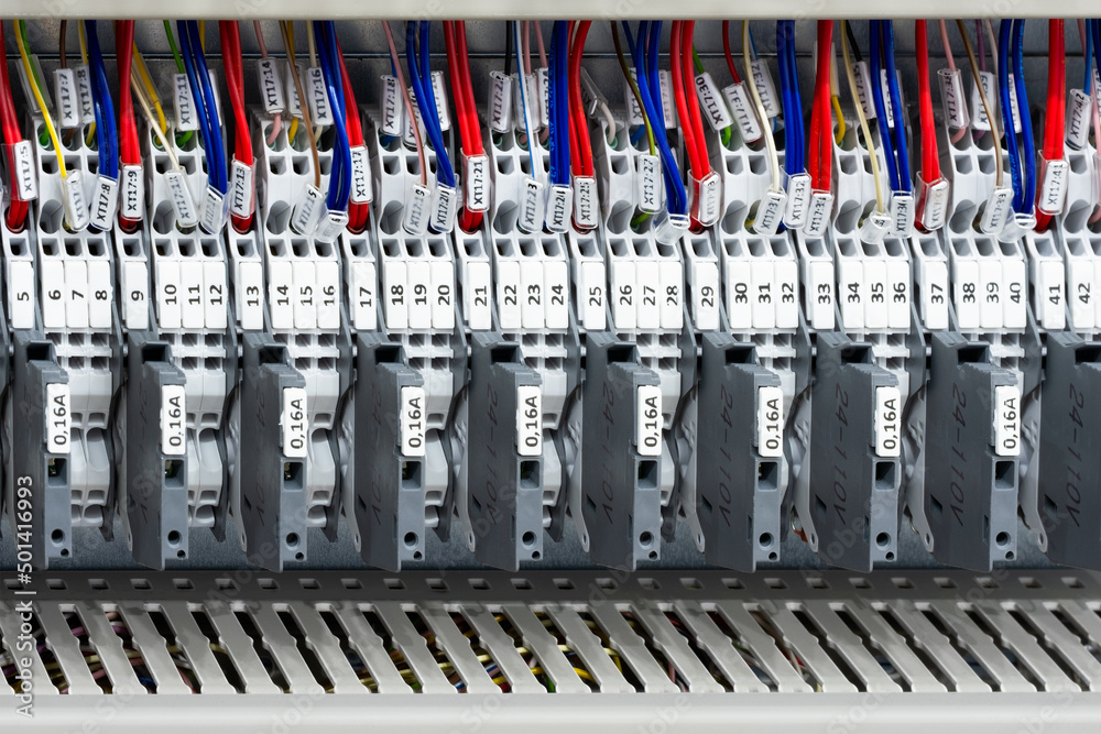 Color wires in a box of distribution of an electricity, PLC Control panel with wiring, lectric control panel enclosure for power and distribution electricity. Color wires in a box of distribution of an electricity, PLC Control panel with wiring, lectric control panel enclosure for power and distribution electricity.