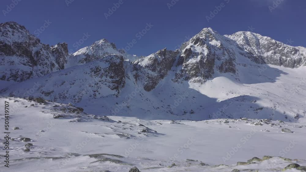 Panorama of Frozen alps mountains nature in cold winter morning with blue sky Panorama of Frozen alps mountains nature in cold winter morning with blue sky