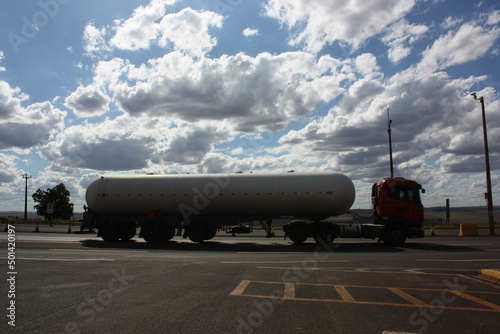 Sky with clouds and fuel truck.