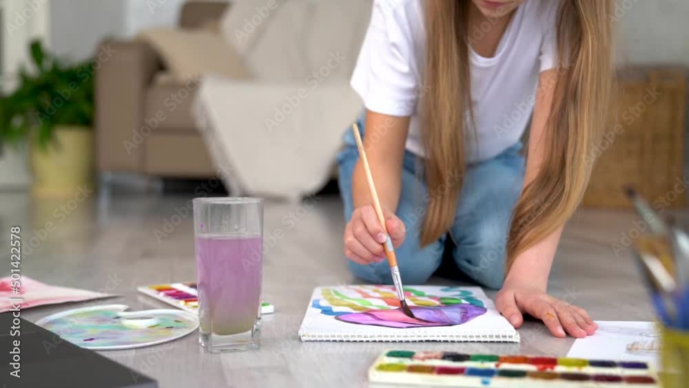 Remote school art lessons. Child smiles studies and gets knowledge remotely. Little girl study online at home does homework. Distance learning education. Quarantine and Social distancing concept. Remote school art lessons. Child smiles studies and gets knowledge remotely. Little girl study online at home does homework. Distance learning education. Quarantine and Social distancing concept.
