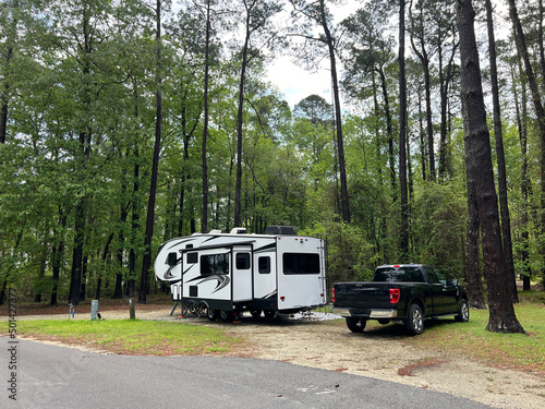 A fifth wheel rv set up for camping at the Santee State Park in South Carolina, USA.