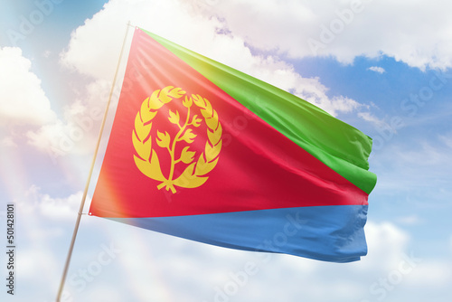 Canvastavla Sunny blue sky and a flagpole with the flag of eritrea