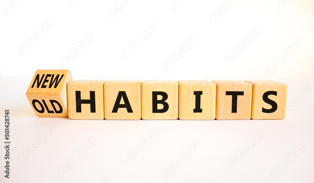 New or old habits symbol. Turned wooden cubes and changed concept words Old habits to New habits. Beautiful white table white background. Business old or new habits concept. Copy space. New or old habits symbol. Turned wooden cubes and changed concept words Old habits to New habits. Beautiful white table white background. Business old or new habits concept. Copy space.