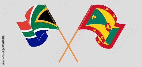 Crossed and waving flags of South Africa and Grenada