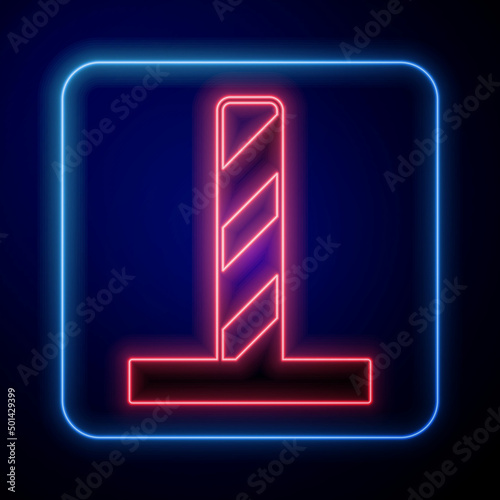 Glowing neon Cat scratching post with toy icon isolated on black background. Vector