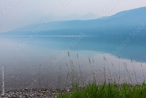 Bowman Lake in the evening with wildfire smoke haze - Glacier National Park  Montana