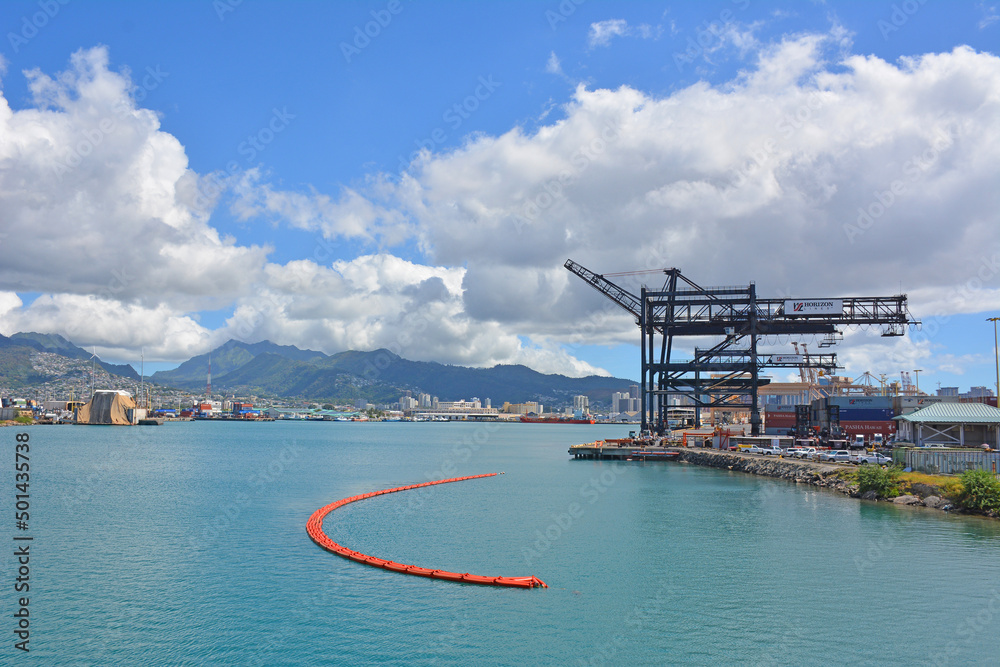 Cargo ship cranes at the the port in Honolulu on the island of Oahu in Hawaii