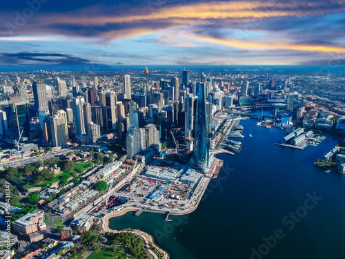 Sydney Harbour Australia with nice colours in the sky. Nice blue water of the Harbour, high rise offices and residential buildings of the City in the background, NSW Australia © Elias Bitar