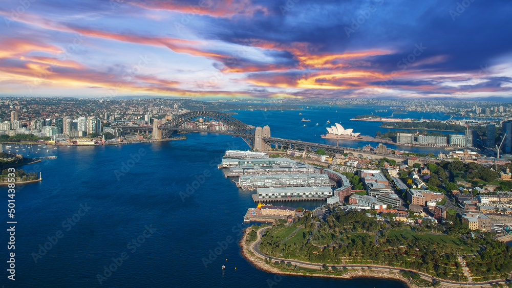 Fototapeta premium Sydney Harbour Australia with nice colours in the sky. Nice blue water of the Harbour, high rise offices and residential buildings of the City in the background, NSW Australia