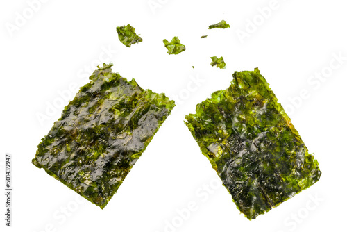Crispy nori sheets tear off with some pieces on white background.  photo