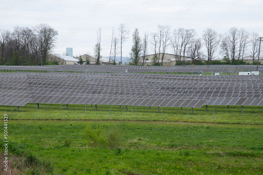 Many solar panels at the field horizontal orientation, gray panels Many solar panels at the field horizontal orientation, gray panels