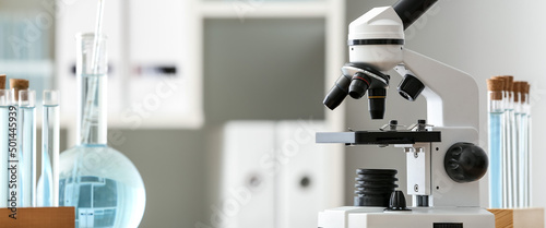 Microscope and glassware on...